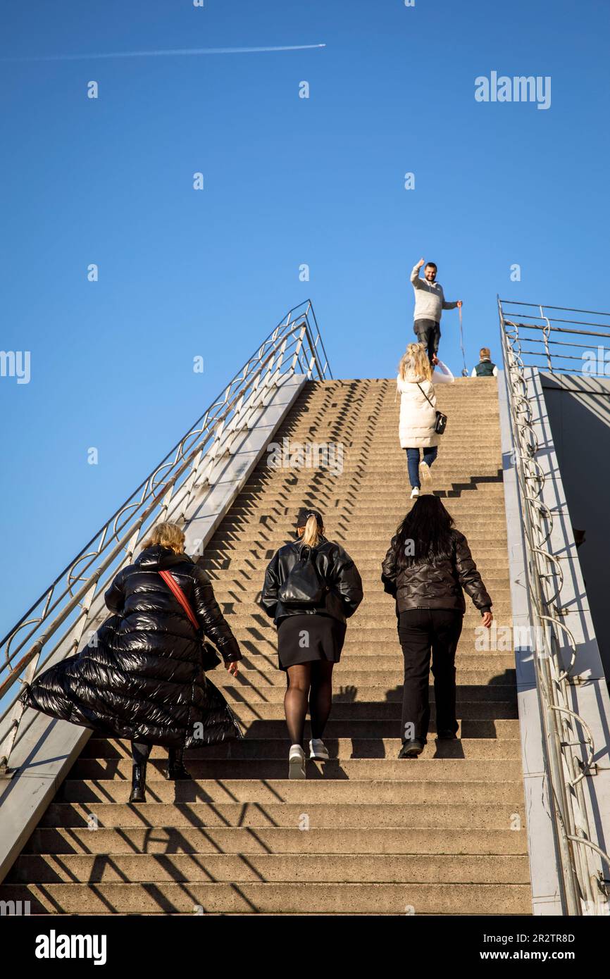 three women in black clothes on the stairs to the observation deck of the Chocolate Museum on the river Rhine, Cologne, Germany. drei Frauen in schwar Stock Photo