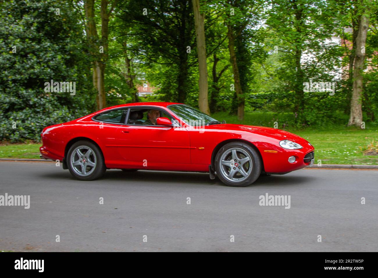 2001 Red JAGUAR XK8 Coupe 3996cc Petrol 5 speed automatic; at the Lytham St Annes Classic & Performance Motor vehicle show displays of classic cars, UK Stock Photo