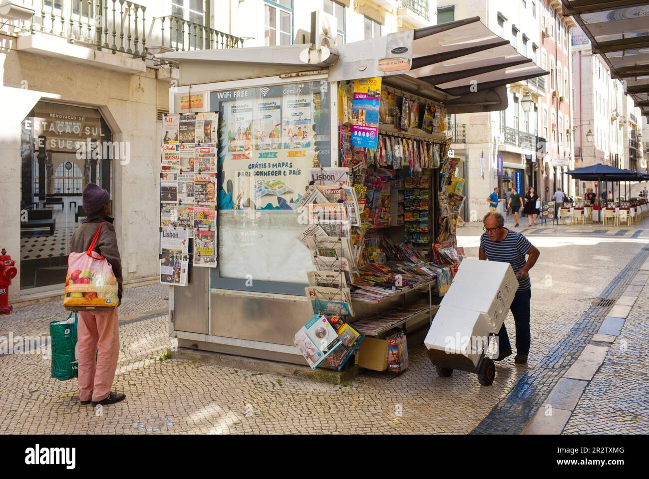 A newspaper stall in the centre of Lisbon with magazines on display outside Stock Photo