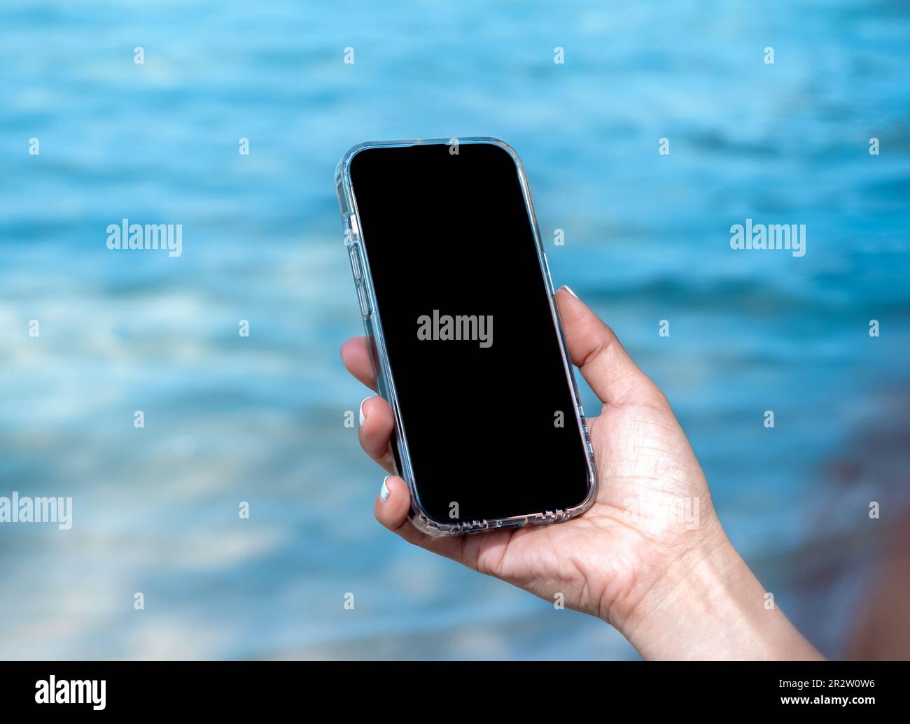 Mobile beach phone with empty screen mockup image of black blank