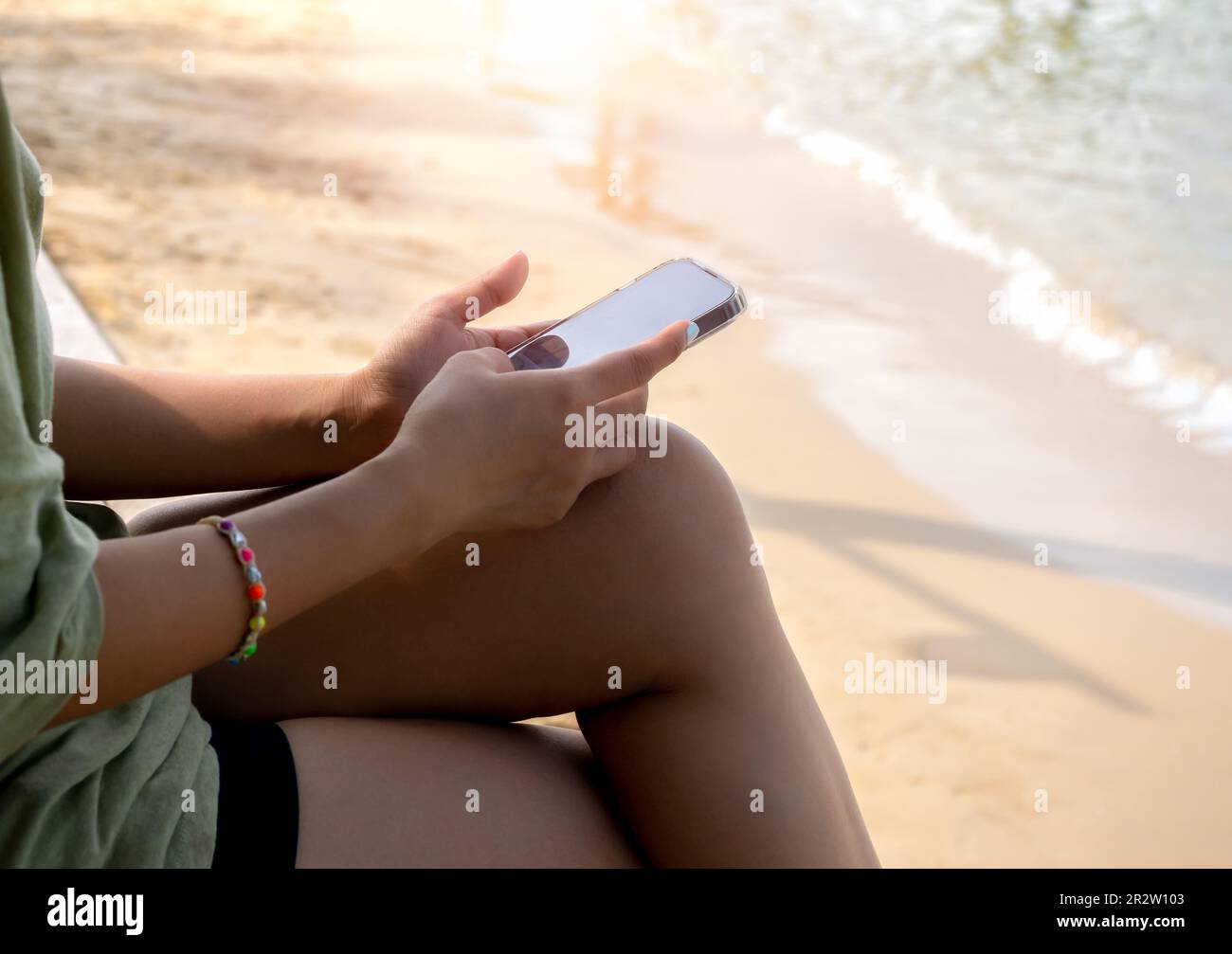 Mobile beach phone using social media online image of black blank