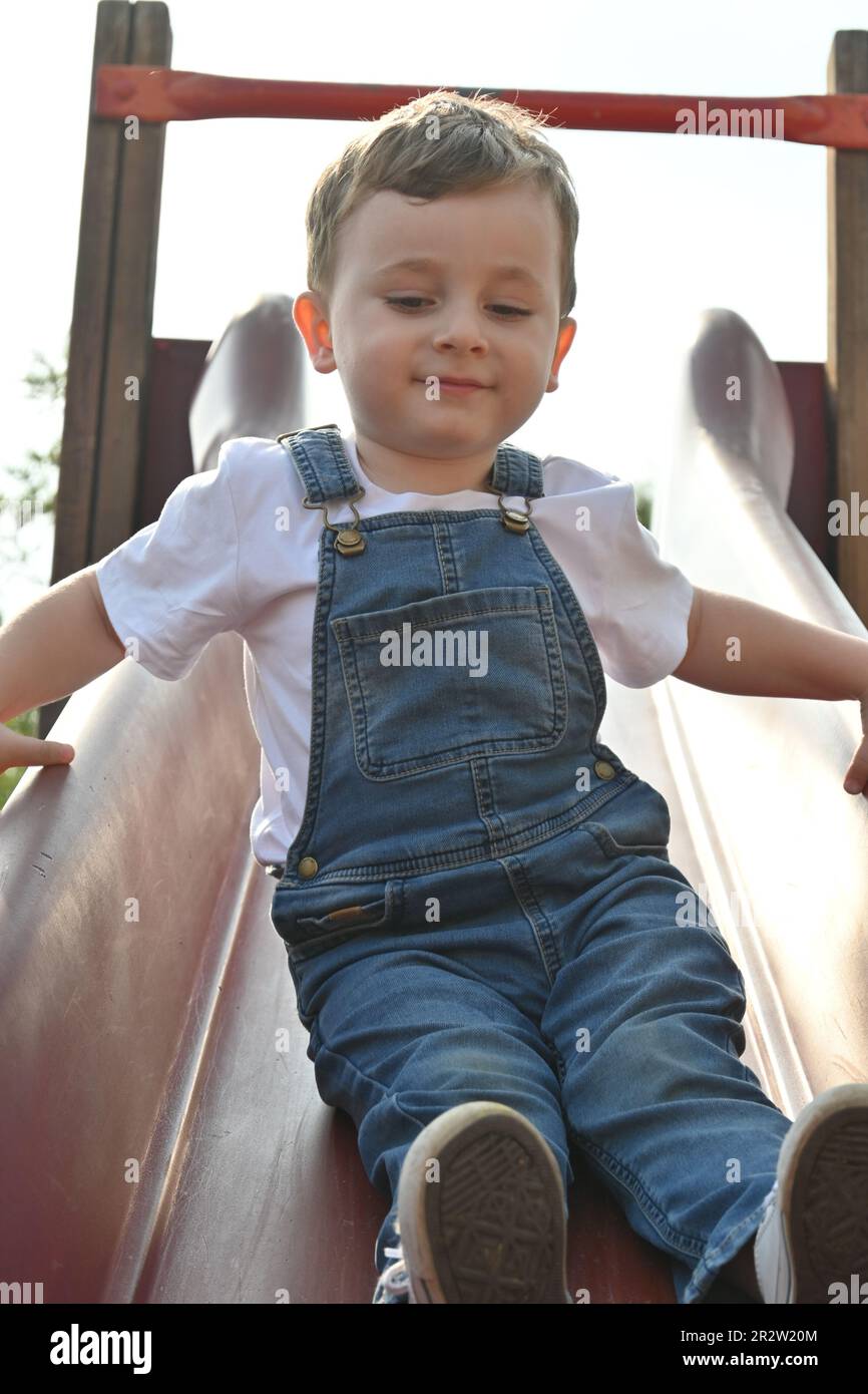 Boy in a red vest hires stock photography and images Alamy