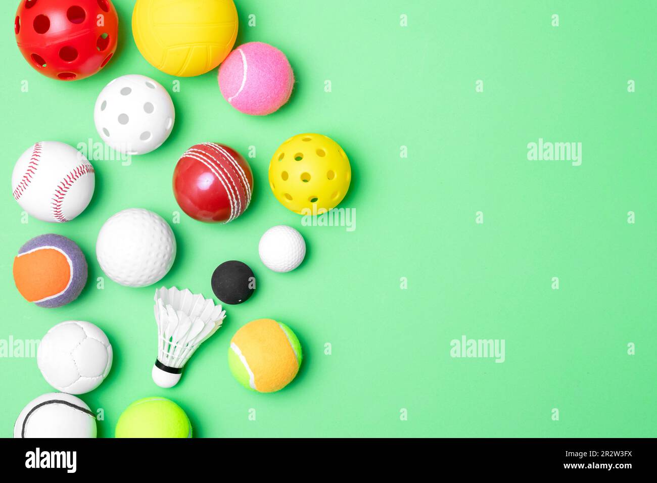 Sports equipment, balls on green background. Horizontal education and  ball sport poster, greeting cards, headers, website Stock Photo