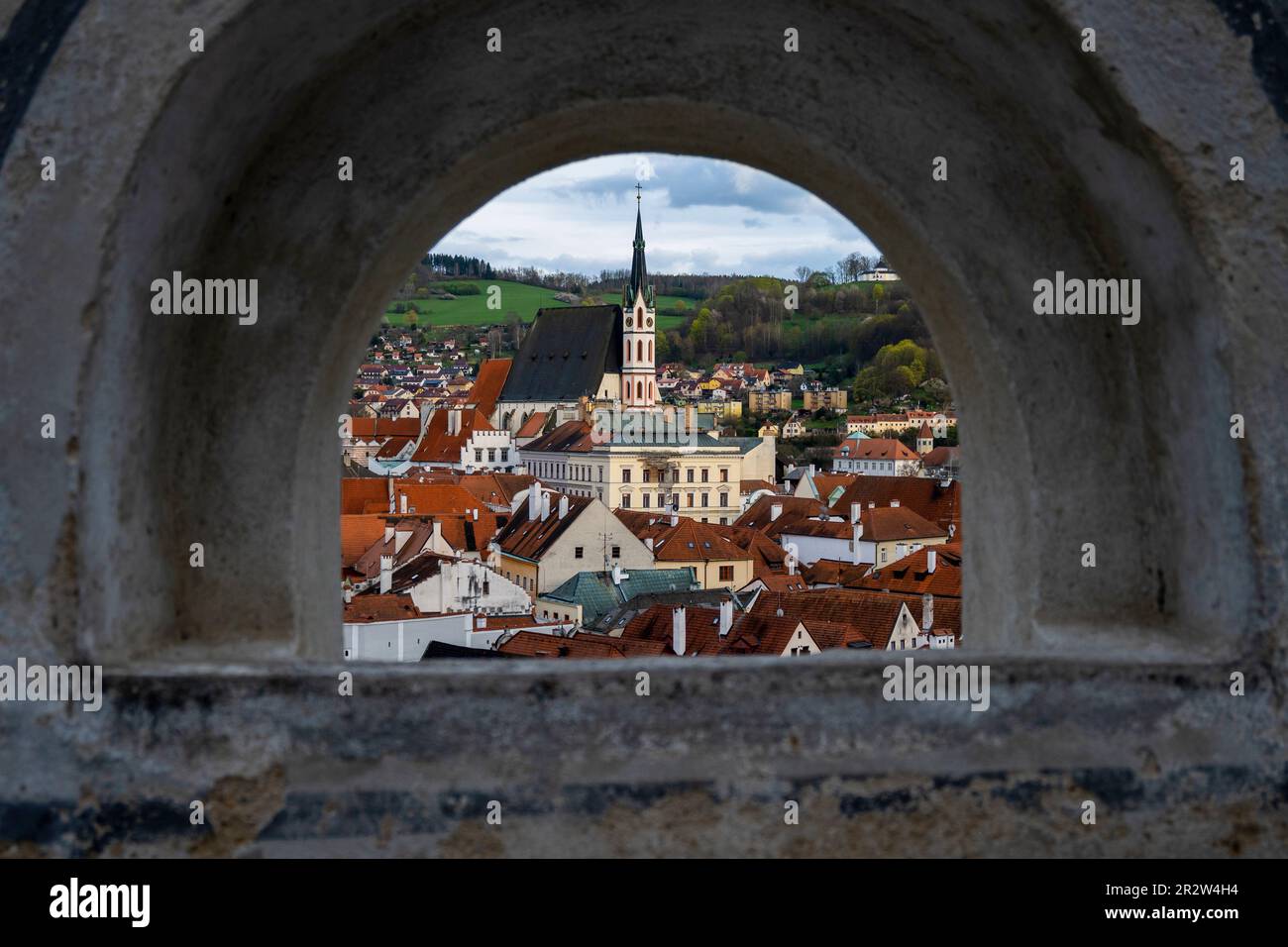 Historical buildings and church of St. Vitus, view from window in castle wall, Cesky Krumlov. Stock Photo