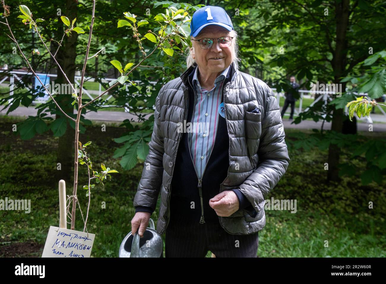 Moscow, Russia. 21st of May, 2023. Soviet and Russian musician Yuri Malikov attends to plant out wild cherry trees in Dynamo Park to mark the Dynamo Moscow centenary as part of the Cherry Forest Festival in Moscow, Russia Stock Photo