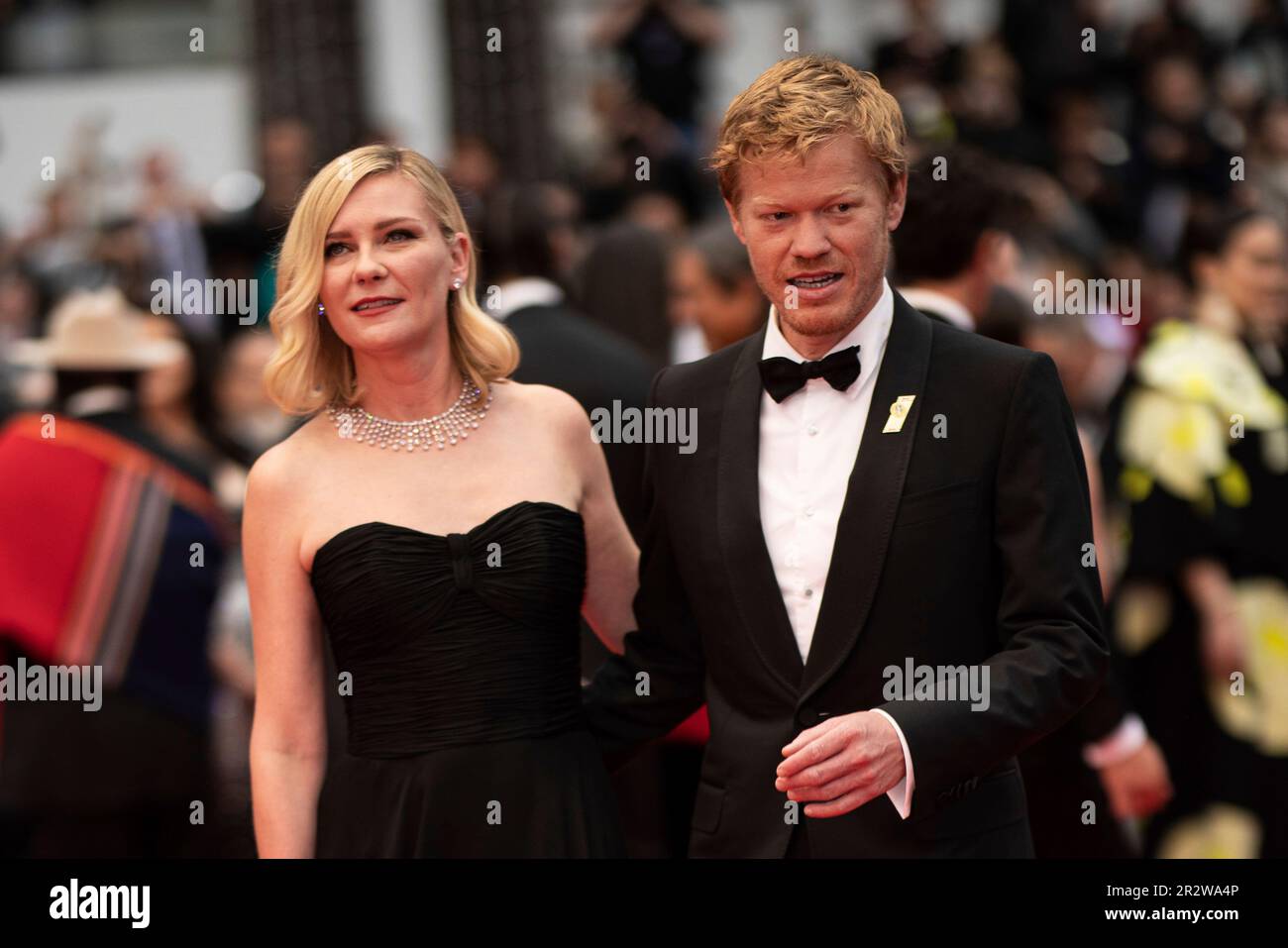 Kirsten Dunst, left, and Jesse Plemons pose for photographers upon