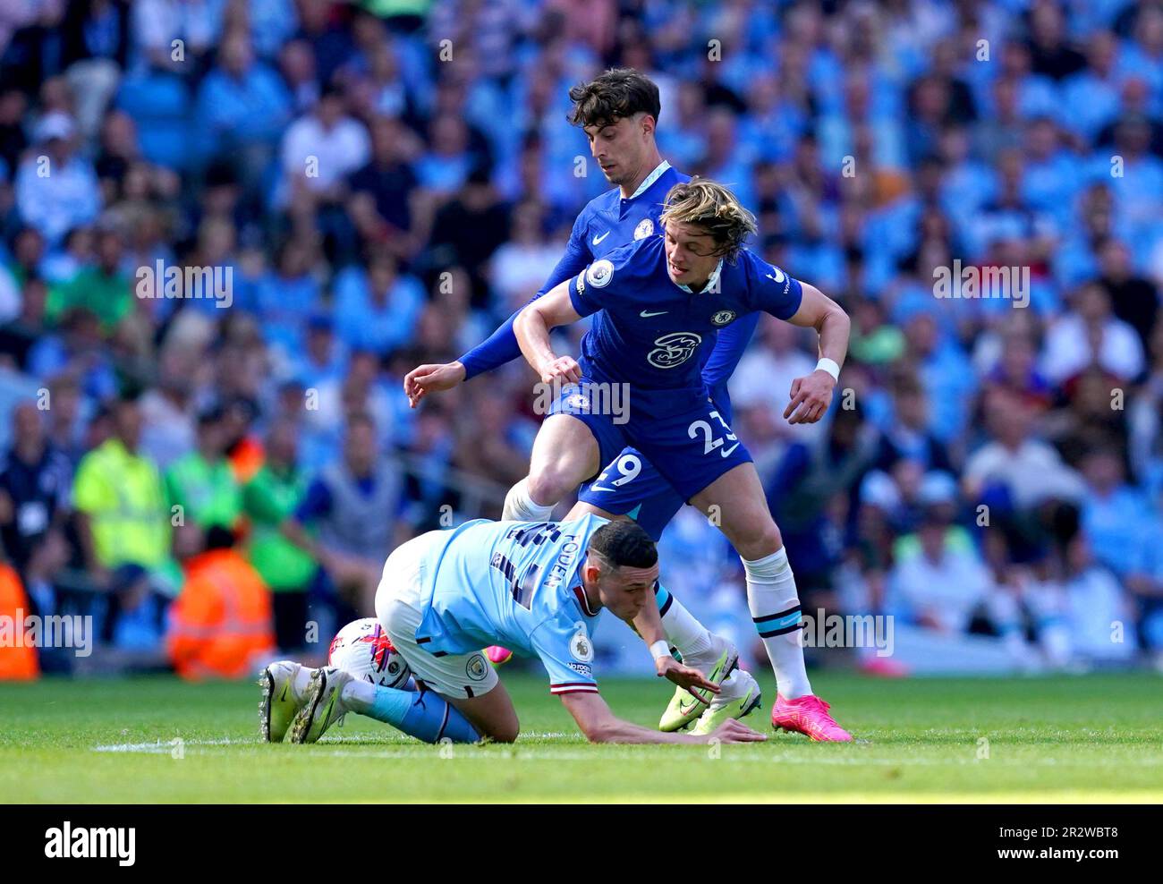 Manchester City's Phil Foden (floor) Battles For The Ball With Chelsea 