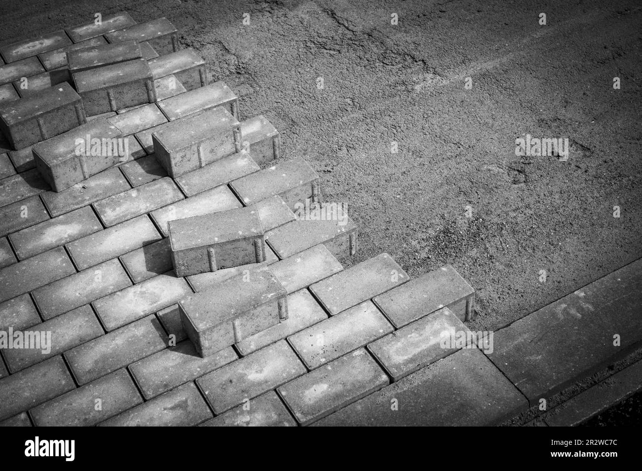 many Paving stones are laid for a new sidewalk Stock Photo Alamy