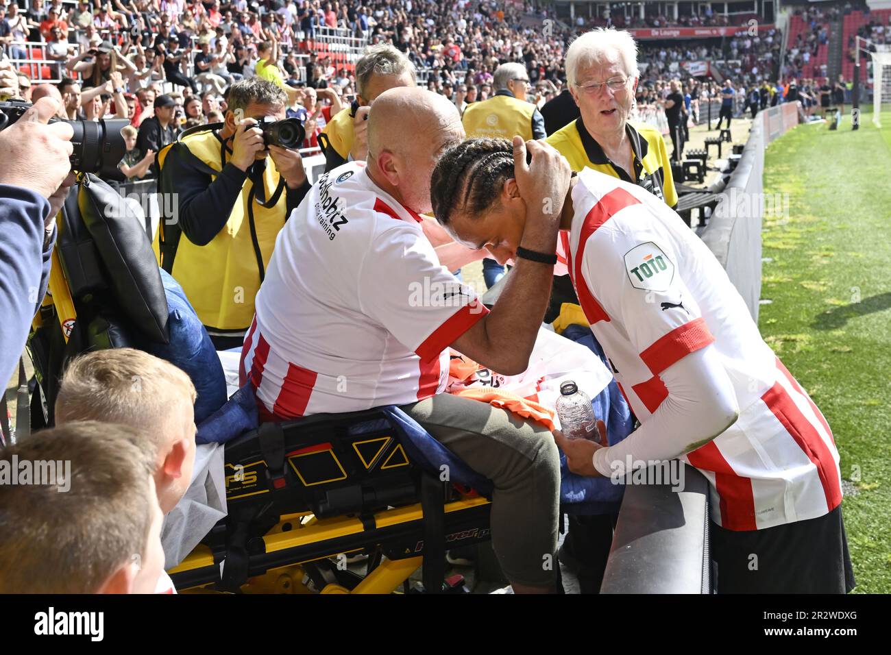 EINDHOVEN - Xavi Simons with an terminally ill supporter during the Dutch premier league match between PSV Eindhoven and SC Heerenveen at Phillips stadium on May 21, 2023 in Eindhoven, Netherlands. ANP OLAF KRAAK Stock Photo