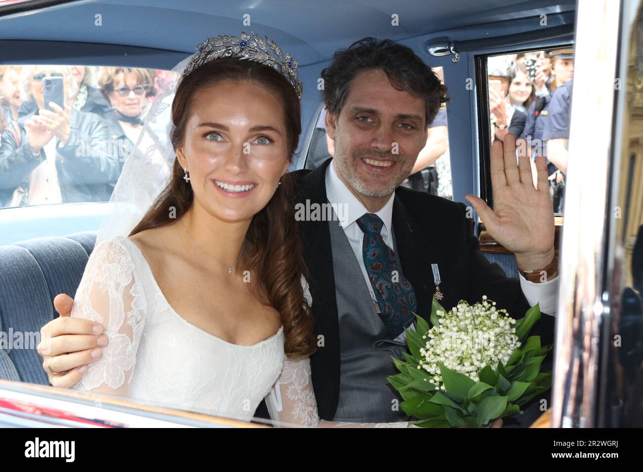 MUNICH, Germany - 20. MAY 2023: the bride, Sophie-Alexandra Princess of Bavaria with a lily of the valley bouquet, in the historic BMW 505 looks on with the groom Prince Ludwig von Bayern, die Braut mit einem Maiglöckchen Blumenstrauß und Ihr Ehemann Prinz Ludwig von Bayern, Prince Ludwig von Bayern and his wife Sophie-Alexandra Princess of Bavaria got Married in the Theatiner Church, Prinz Ludwig is part of the Wittelsbacher dynasty . WITTELSBACHER HOCHZEIT, Royal Wedding in Munich on 20. May 2023, in Germany. Ludwig Prinz von Bayern und seine Frau Sophie-Alexandra Prinzessin von Bayern, Stock Photo