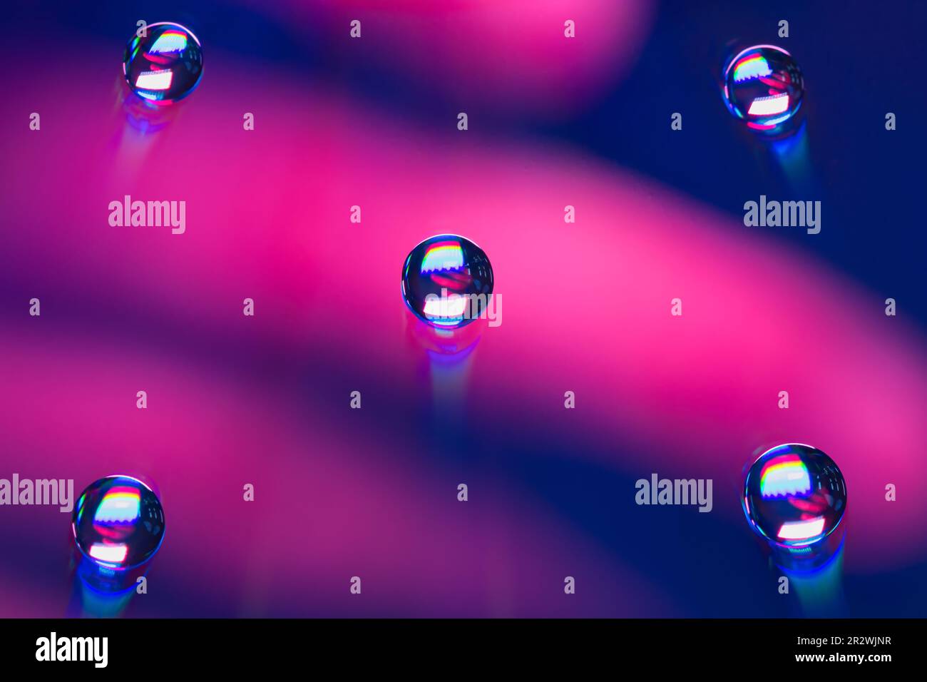 Waterdrops on a CD with color light Stock Photo