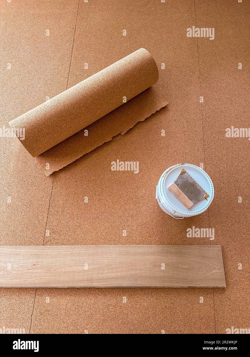 Cork is laid on the floor to insulate against impact sound. Stock Photo