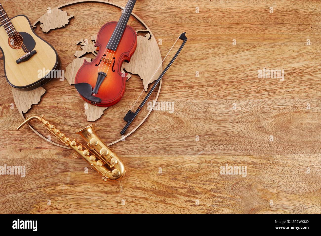 Happy world music day. Musical instruments with globe background. Stock Photo