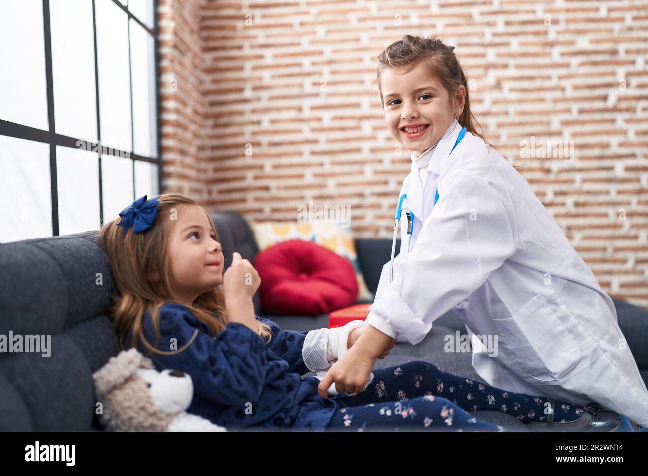 Happy kids playing doctor hi-res stock photography and images - Alamy