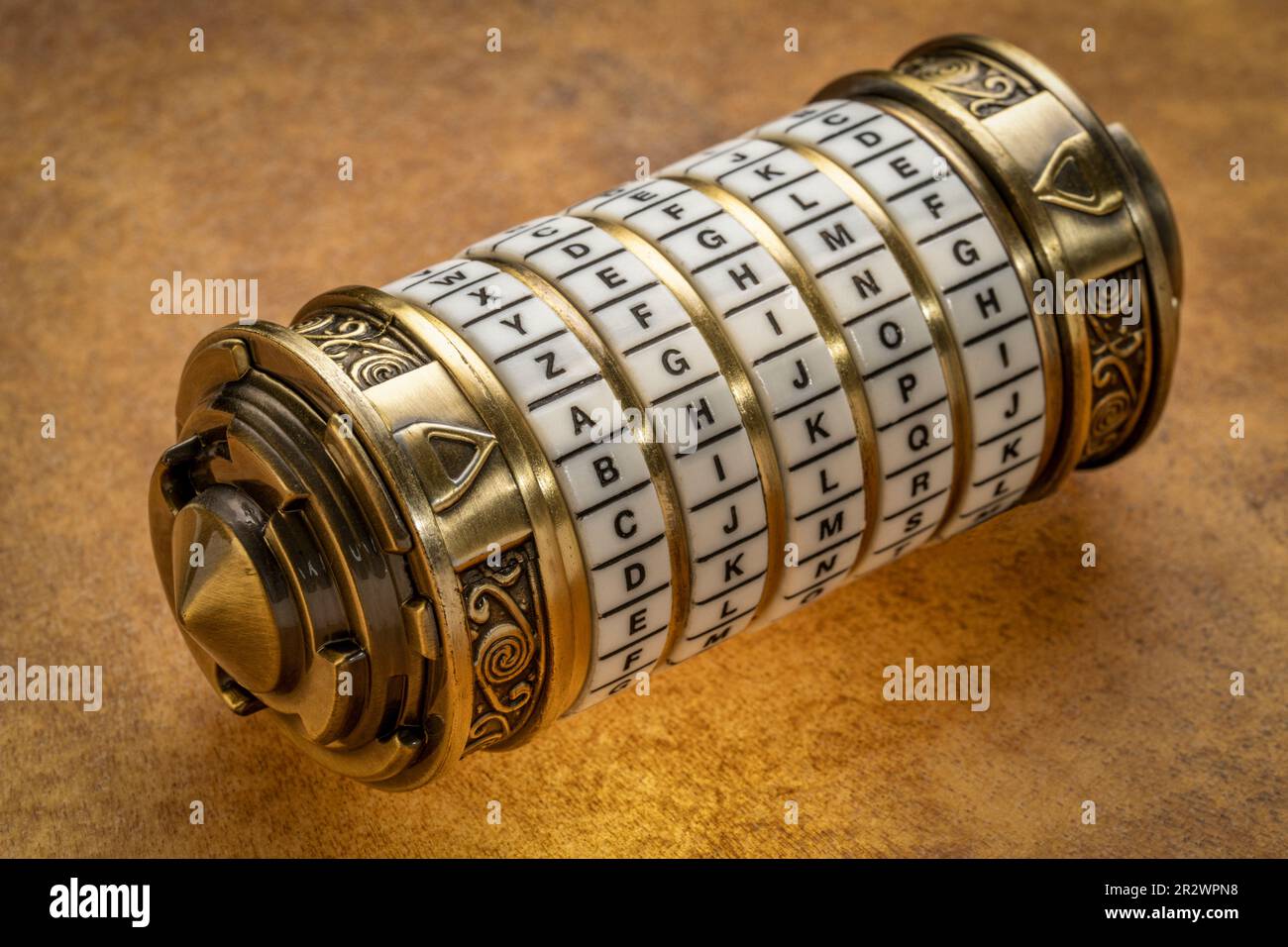 aging word as a password to combination puzzle box with rings of letters, cryptography and lifestyle concept Stock Photo