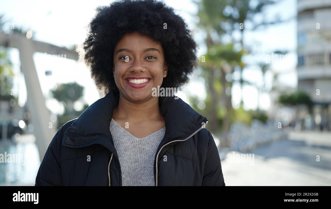 African american woman smiling confident standing at park Stock Photo ...