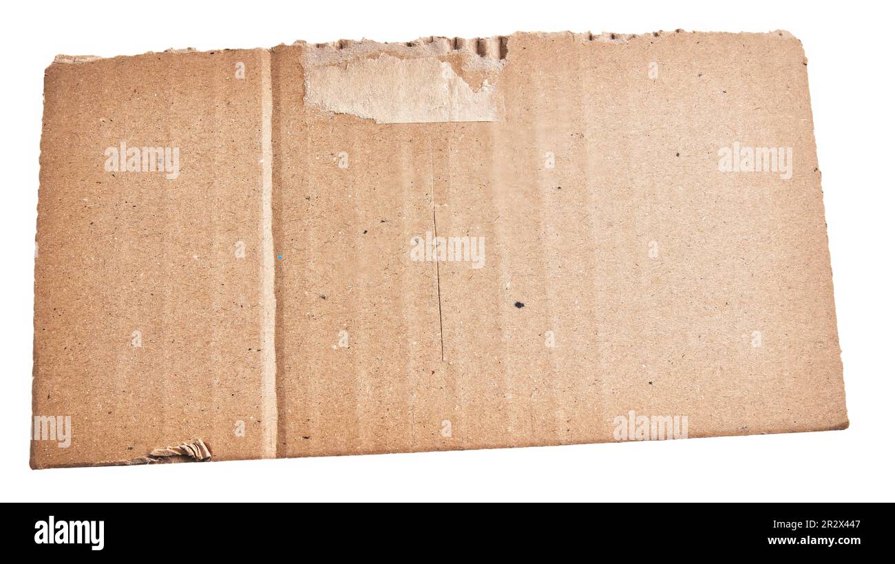 One ripped piece of cardboard material over isolated white background ...