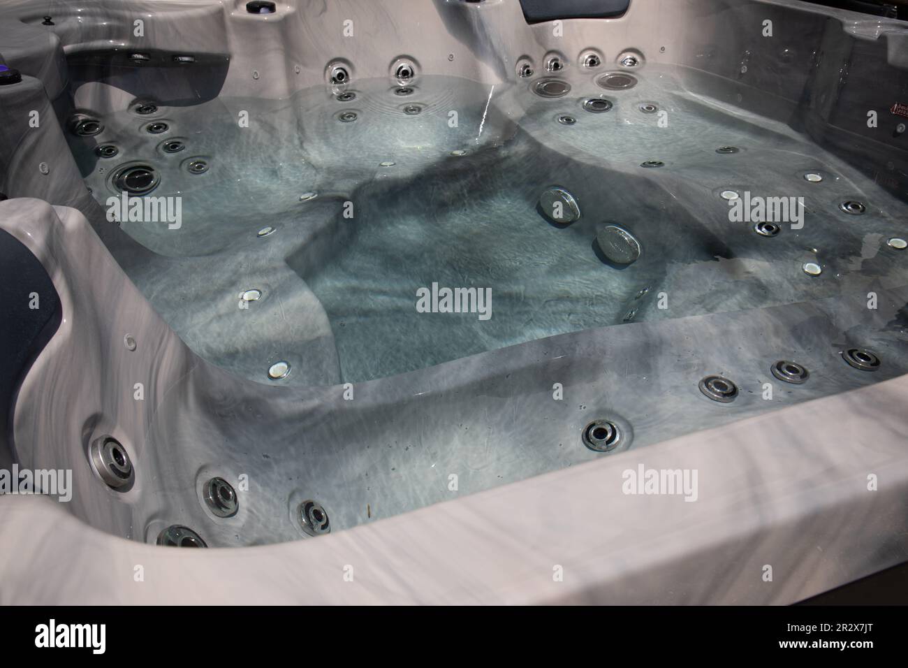 white whirlpool bathtub spa interior to make water bubbles hydromassage modern bath basin Stock Photo
