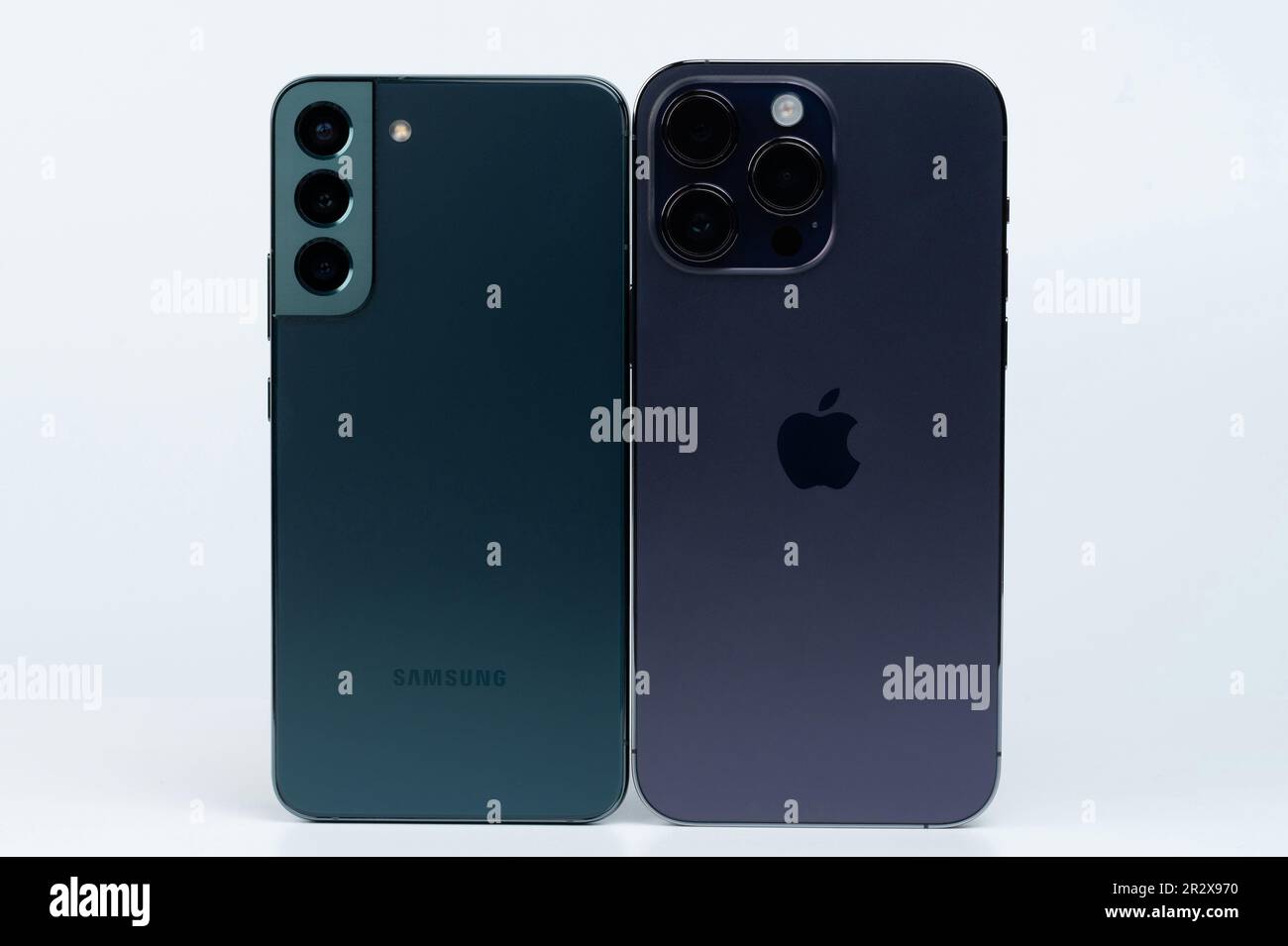 New york, USA - May 14, 2023: Green and purple smartphone back with camera set Stock Photo