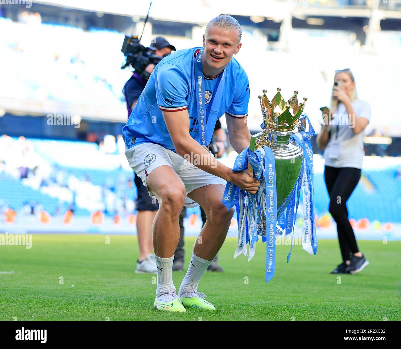 Erling Haaland #9 of Manchester City with the Premier League trophy 