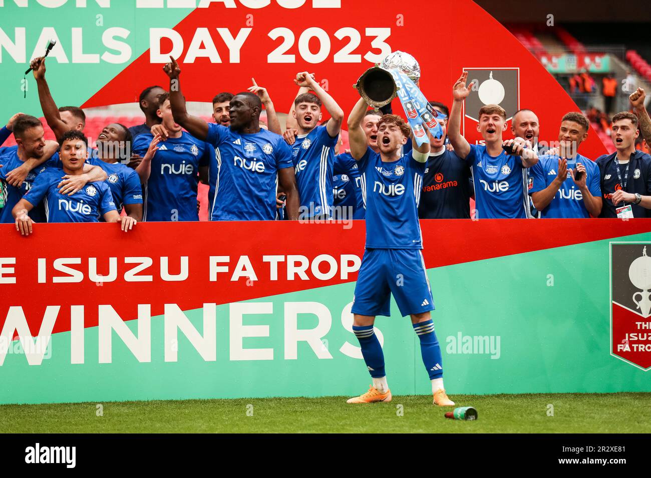 Halifax Town's Jack Senior lifts the trophy following the Isuzu FA