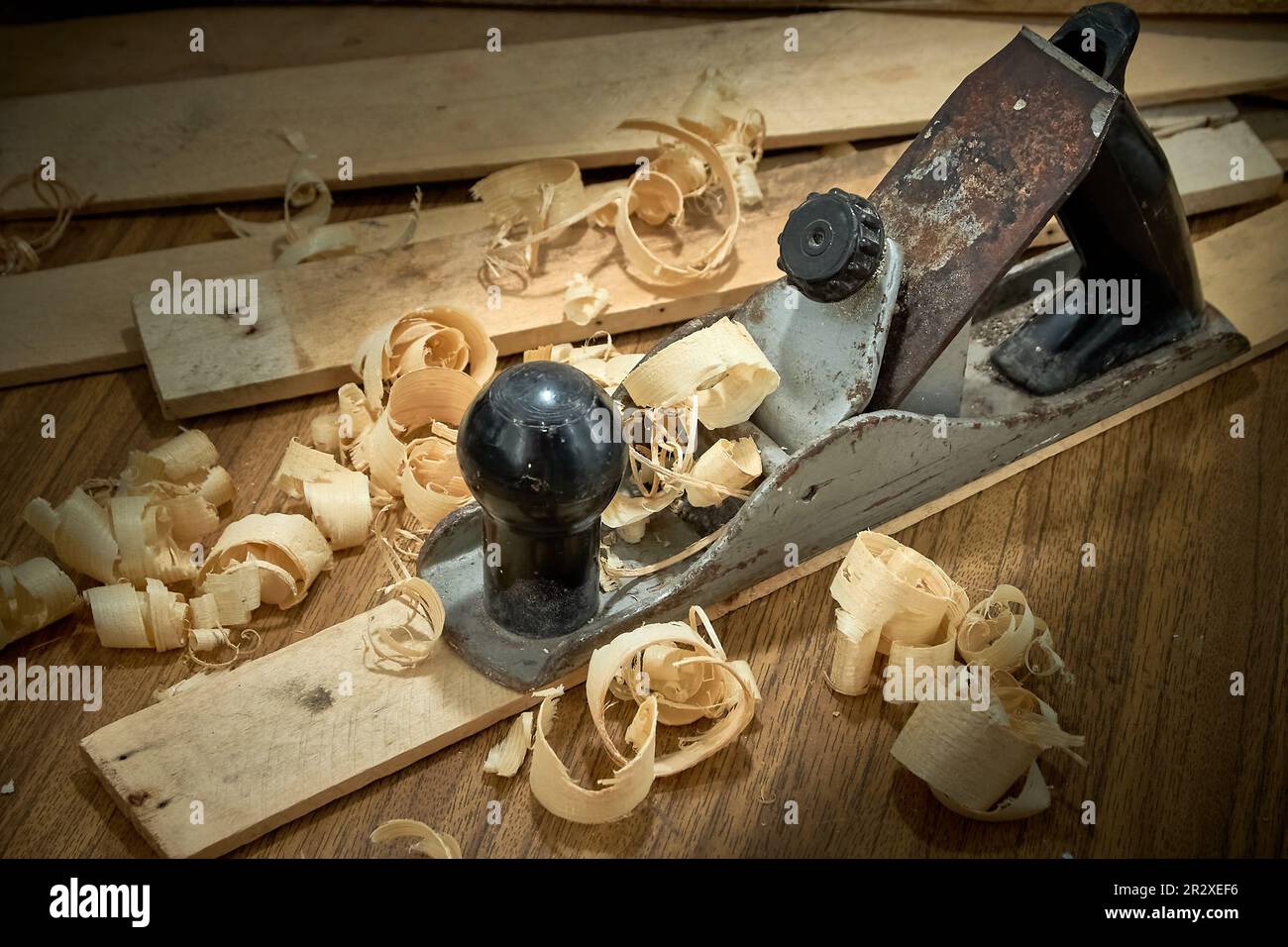 Planer and shavings after planing wooden boards, carpentry work Stock Photo Alamy