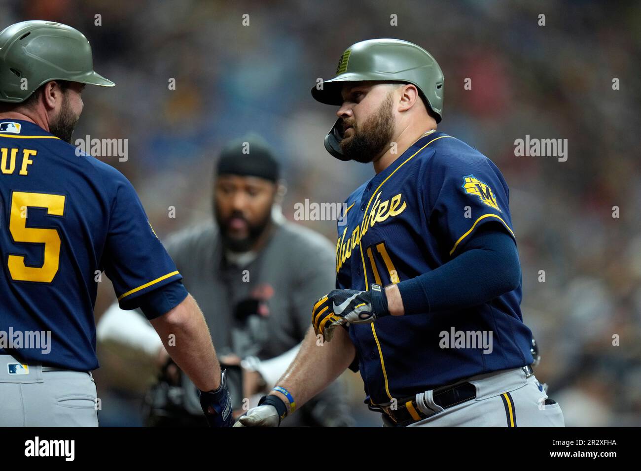 Milwaukee Brewers' Rowdy Tellez (11) celebrates his two-run home run off  Tampa Bay Rays' Cooper Criswell with Darin Ruf during the fourth inning of  a baseball game Sunday, May 21, 2023, in