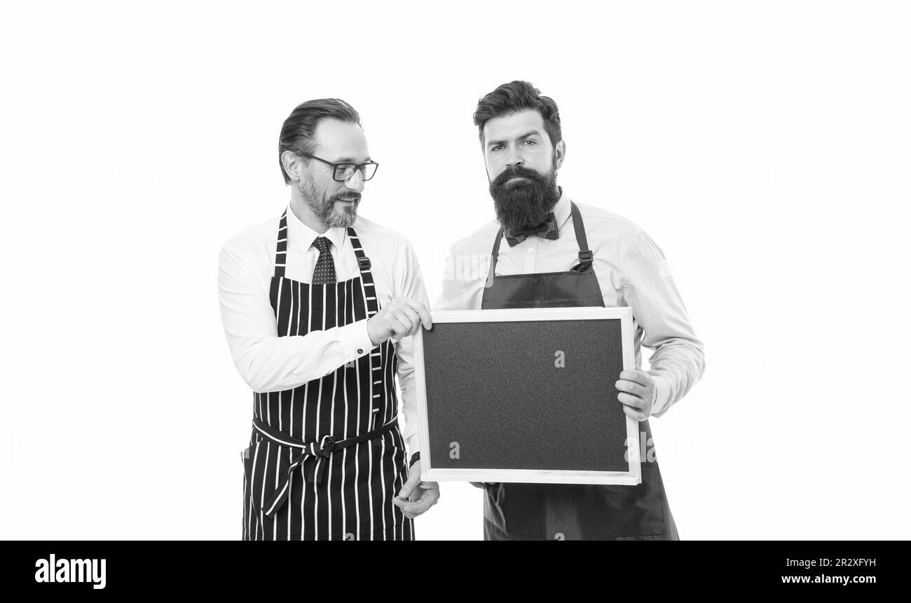 Workers wanted. Bartender with blackboard. Hipster bartender show blackboard copy space. Men bearded hipster informing you. Opening soon. Men bearded Stock Photo