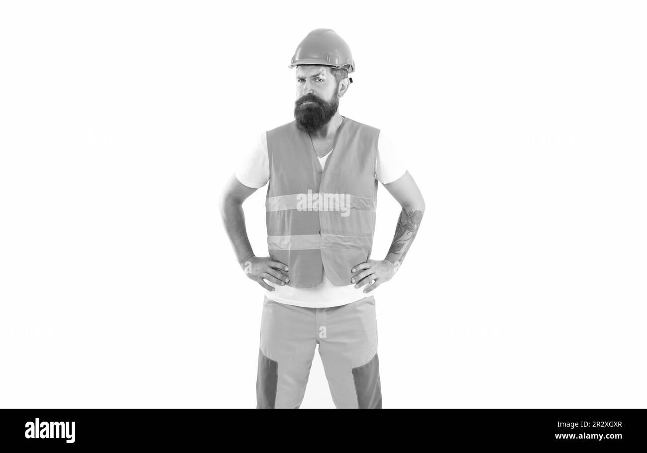 sad bearded supervisor man in orange vest. studio shot of supervisor man wearing helmet. Stock Photo