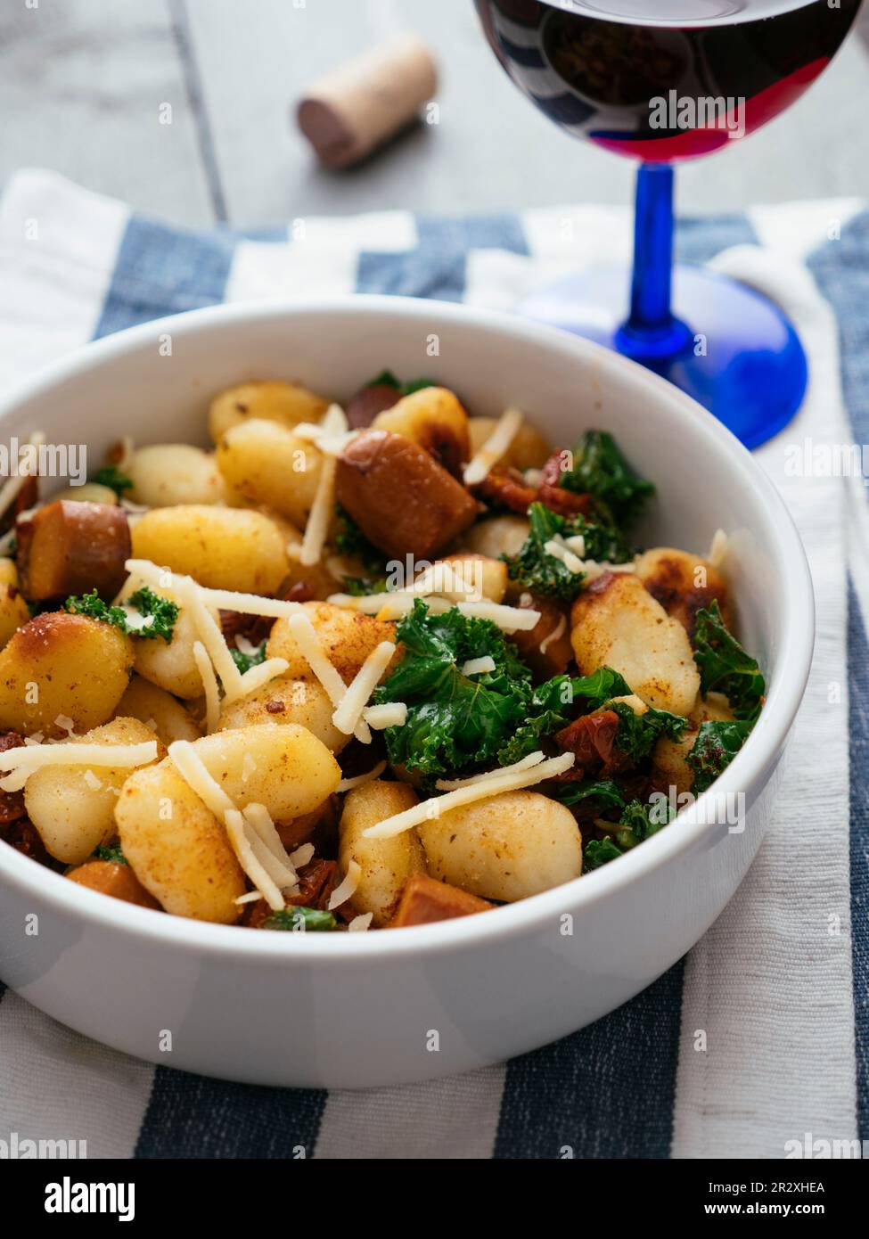 Gnocchi with Vegan Sausage, Kale and Sun-dried Tomatoes Stock Photo