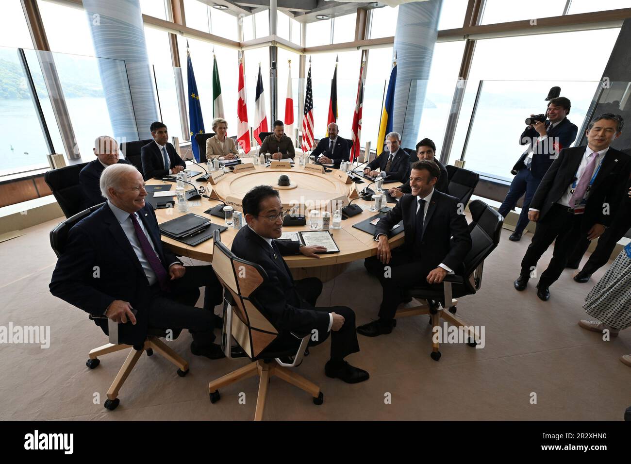 Hiroshima, Japan. 21 May, 2023. Leaders of the G7 group of nations hold a session with Ukrainian President Volodymyr Zelenskyy, rear center, at the G7 Leaders Summit at the Grand Prince Hotel, May 21, 2023 in Hiroshima, Japan. Sitting from left: U.S. President Joe Biden, German Chancellor Olaf Schotz, U.S. President Joe Biden, British Prime Minister Rishi Sunak, European Commission President Ursula von der Leyen, Ukrainian President Volodymyr Zelenskyy, European Council President Charles Michel, Italian ambassador to Japan Gianluigi Benedetti, Canadian Prime Minister Justin Trudeau, French Pre Stock Photo