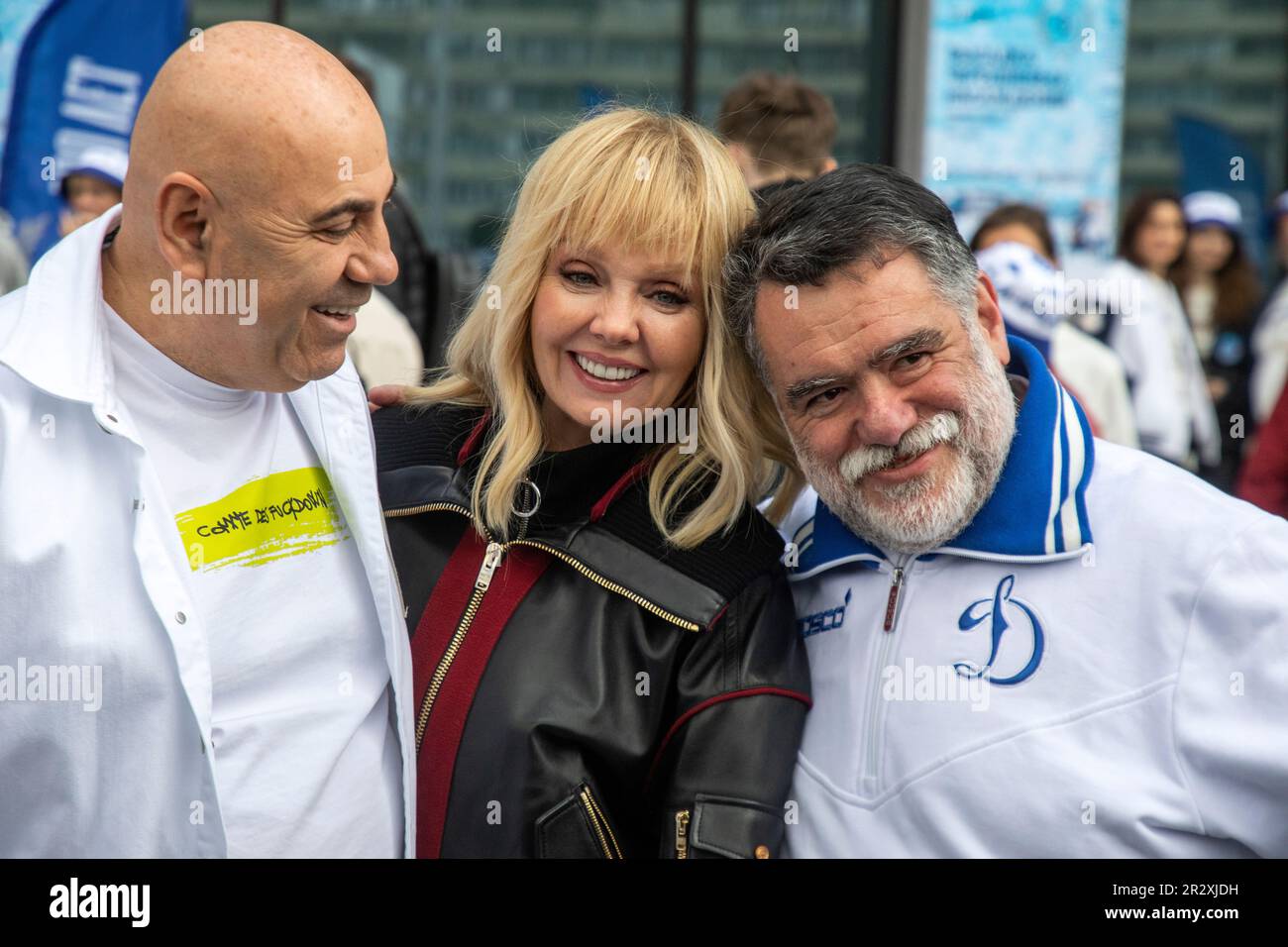 Moscow, Russia. 21st of May, 2023. The record producer Iosif Prigozhin (L), the singer Valeria and Bosco di Ciliegi President Mikhail Kusnirovich (R) poses for medias before planting out wild cherry trees in Dynamo Park to mark the Dynamo Moscow centenary as part of the Cherry Forest Festiva, in Moscow, Russia Stock Photo