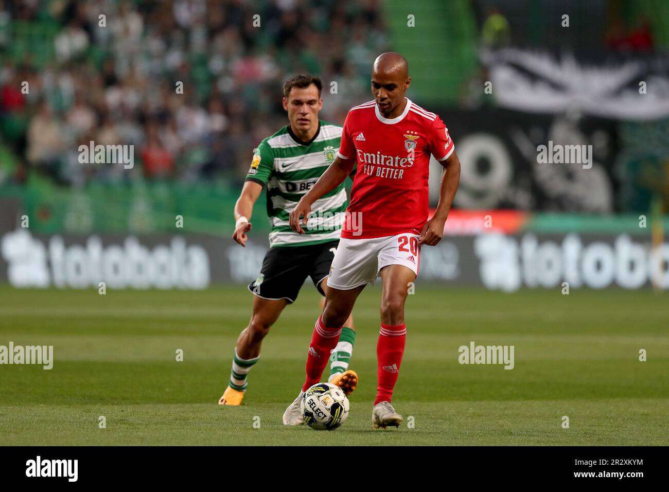 Lisbon, Portugal. 21st May, 2023. Joao Mario of Benfica (R ) vies with Manuel Ugarte of Sporting CP during the Portuguese League football match between Sporting CP and SL Benfica at Jose Alvalade stadium in Lisbon, Portugal on May 21, 2023. (Credit Image: © Pedro Fiuza/ZUMA Press Wire) EDITORIAL USAGE ONLY! Not for Commercial USAGE! Credit: ZUMA Press, Inc./Alamy Live News Stock Photo