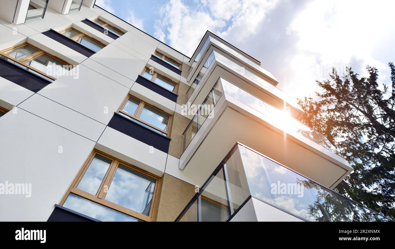 Eco architecture. Green tree and new apartment building. The harmony of ...