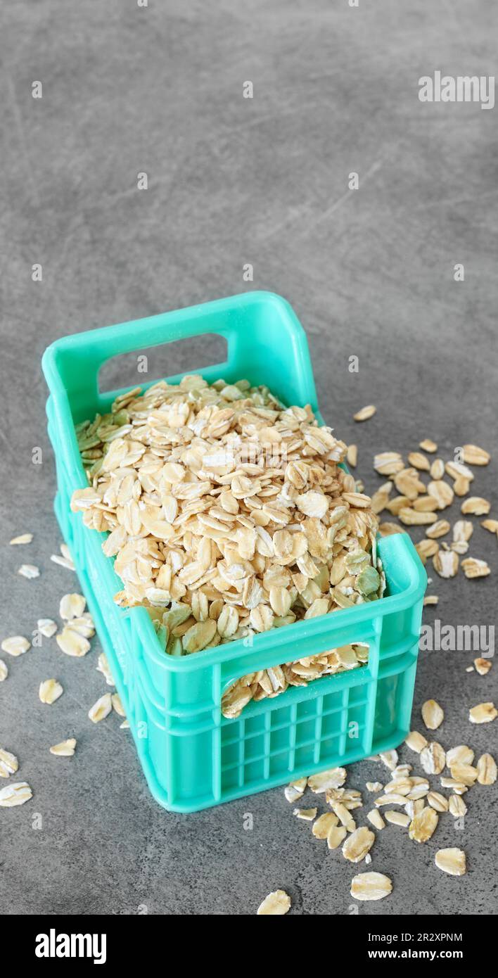 Close up picture of whole grain oats in miniature container, selective focus. Stock Photo