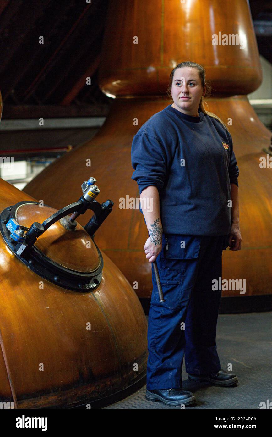 Female wkisky distiller at Strathisla Distillery in Keith the oldest continuously operating distillery in Scotland Aberdeenshire Stock Photo