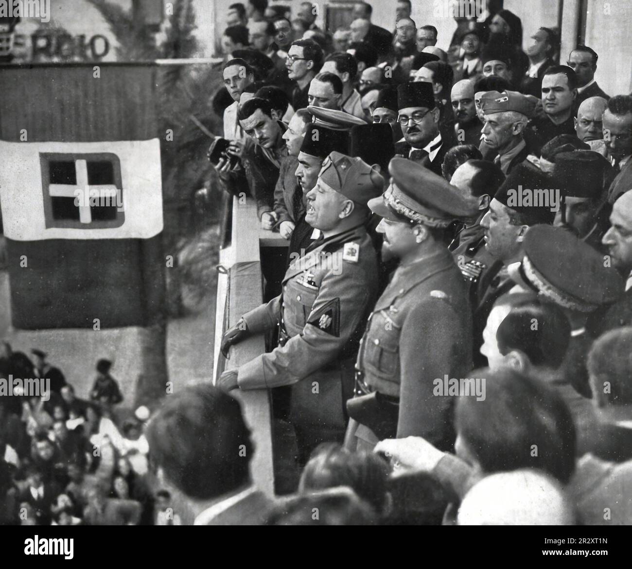 1937, Italian dictator Benito Mussolini with Italo Balbo and his staff speaking to the crowd. Stock Photo