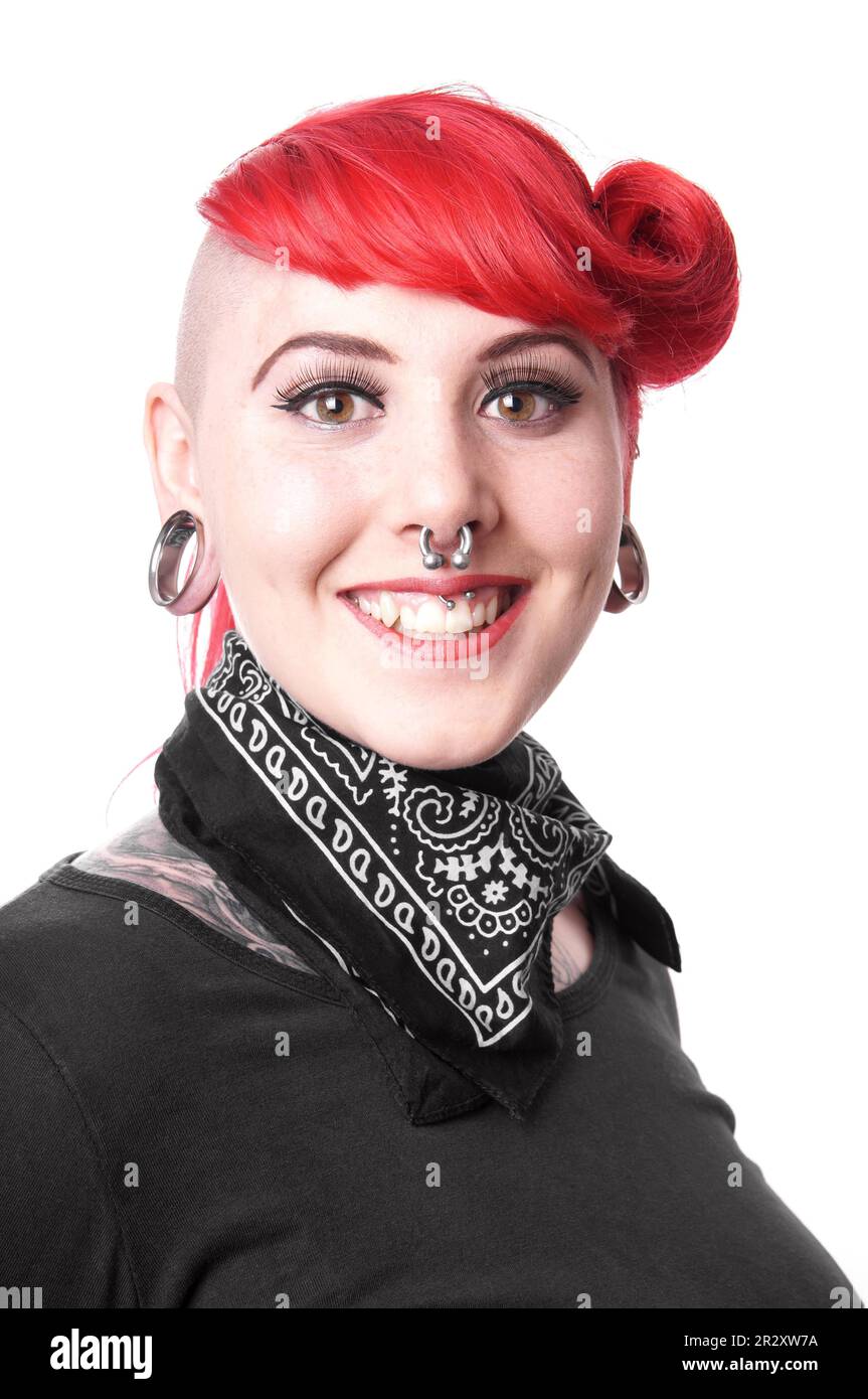 Young woman with facial piercings and tattoos Stock Photo