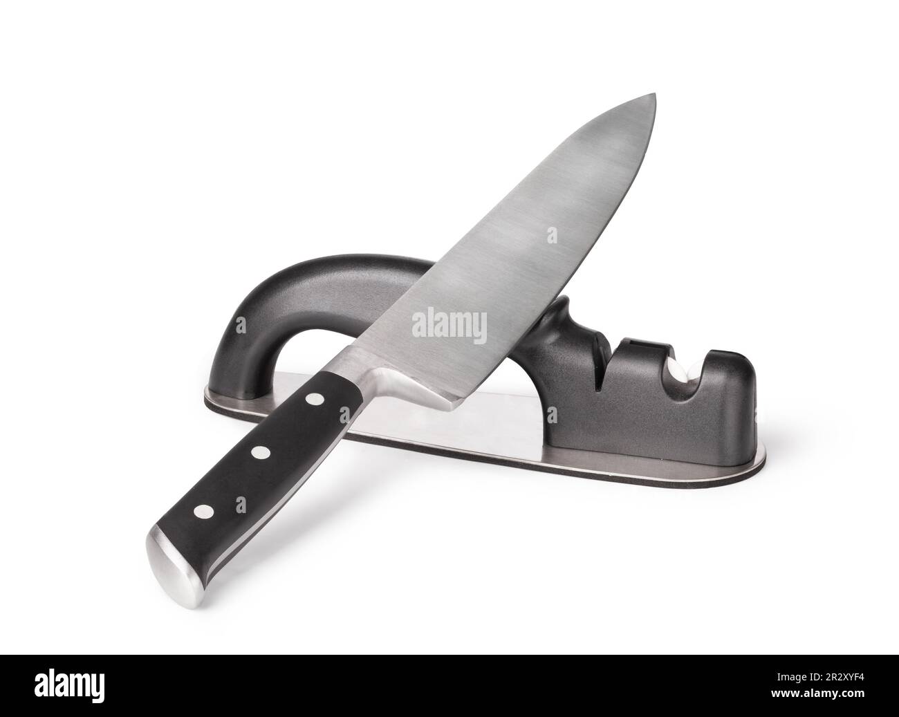Grindstone and knife isolated on the white background Stock Photo