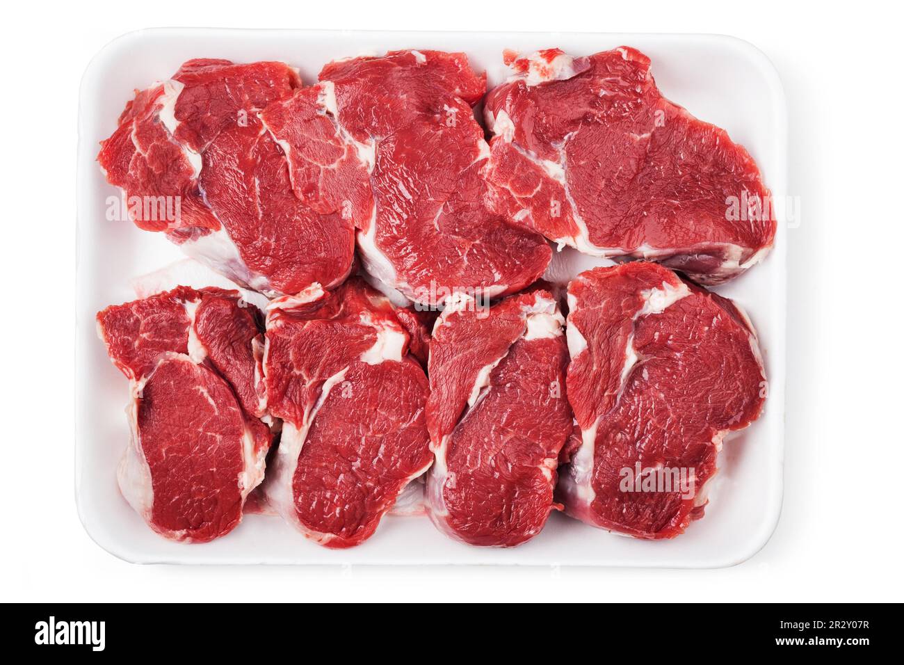 Raw beef meat isolated on white Stock Photo - Alamy