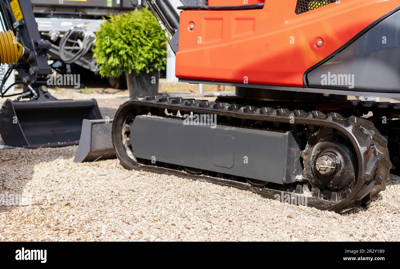 Caterpillar track of small mobile construction tractor. Stock Photo
