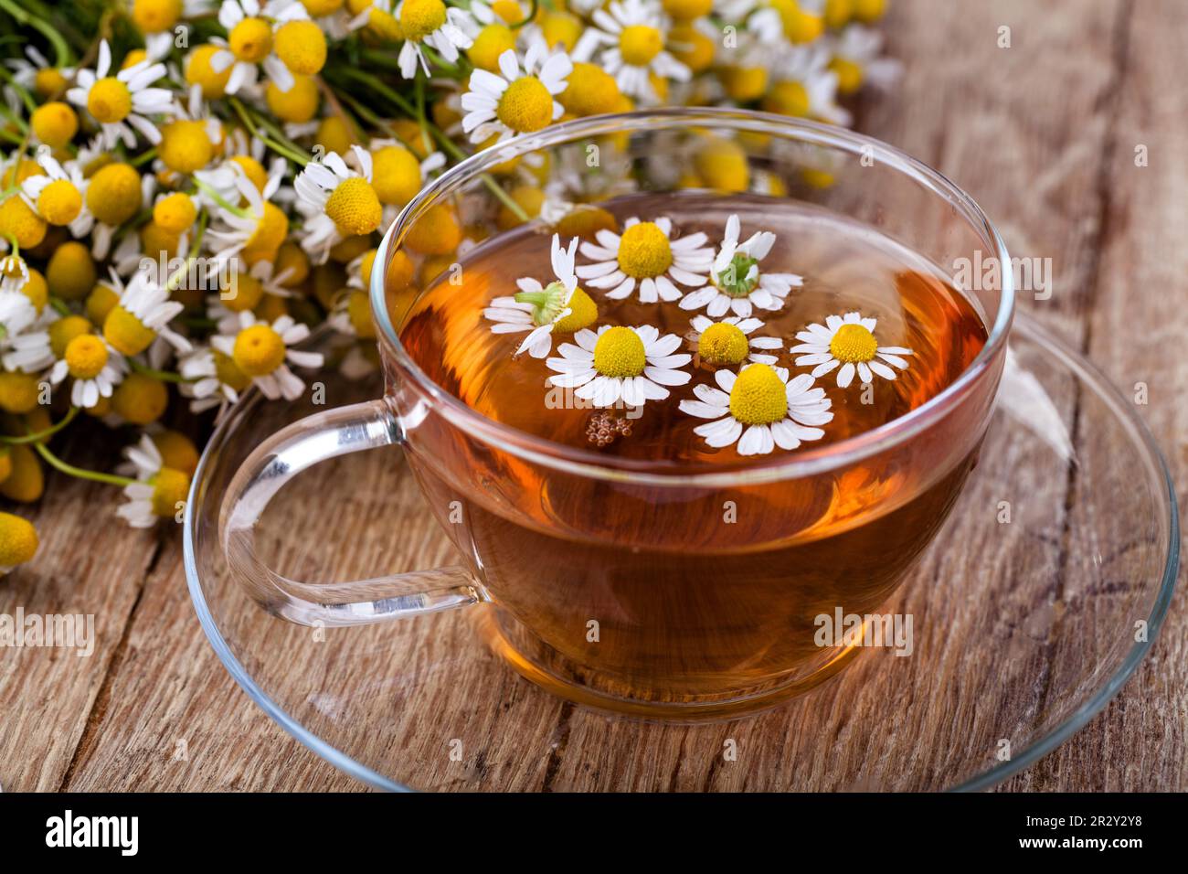 Cup of medicinal chamomile tea on a wooden Stock Photo - Alamy