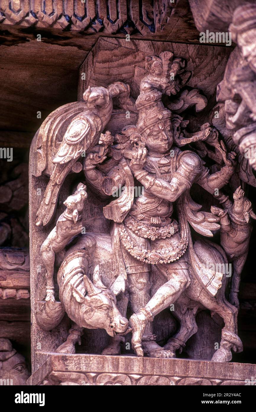 Venugopala Krishna with His Cow, 17th century wooden carvings in Meenakshi-Sundareswarar temple Chariot at Madurai, Tamil Nadu, South India, India Stock Photo