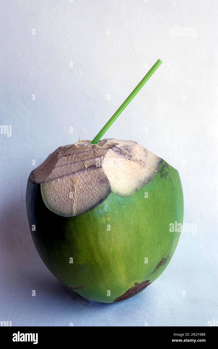 Tender green coconut with straw, ready to drink, Tamil Nadu, South India, India, Asia Stock Photo