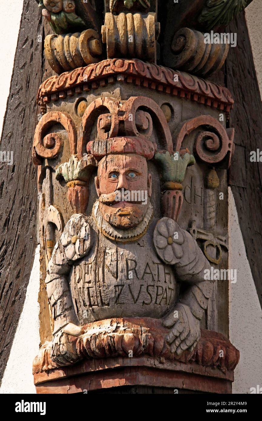 Artful carvings on corner beams of half-timbered house, old town of Kronberg im Taunus, Hesse, Germany Stock Photo