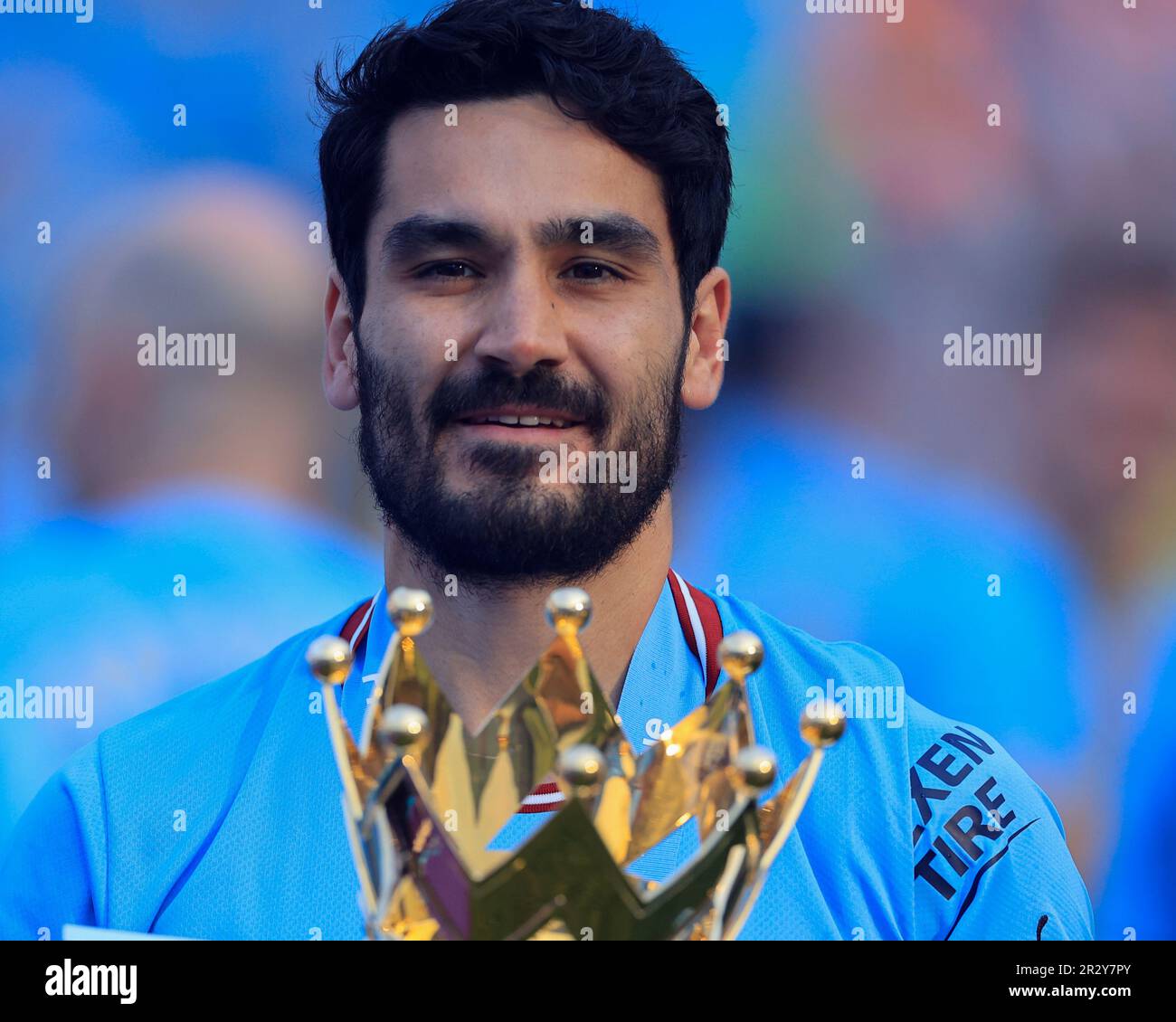 Ilkay Gundogan #8 of Manchester City with the Premier League trophy 