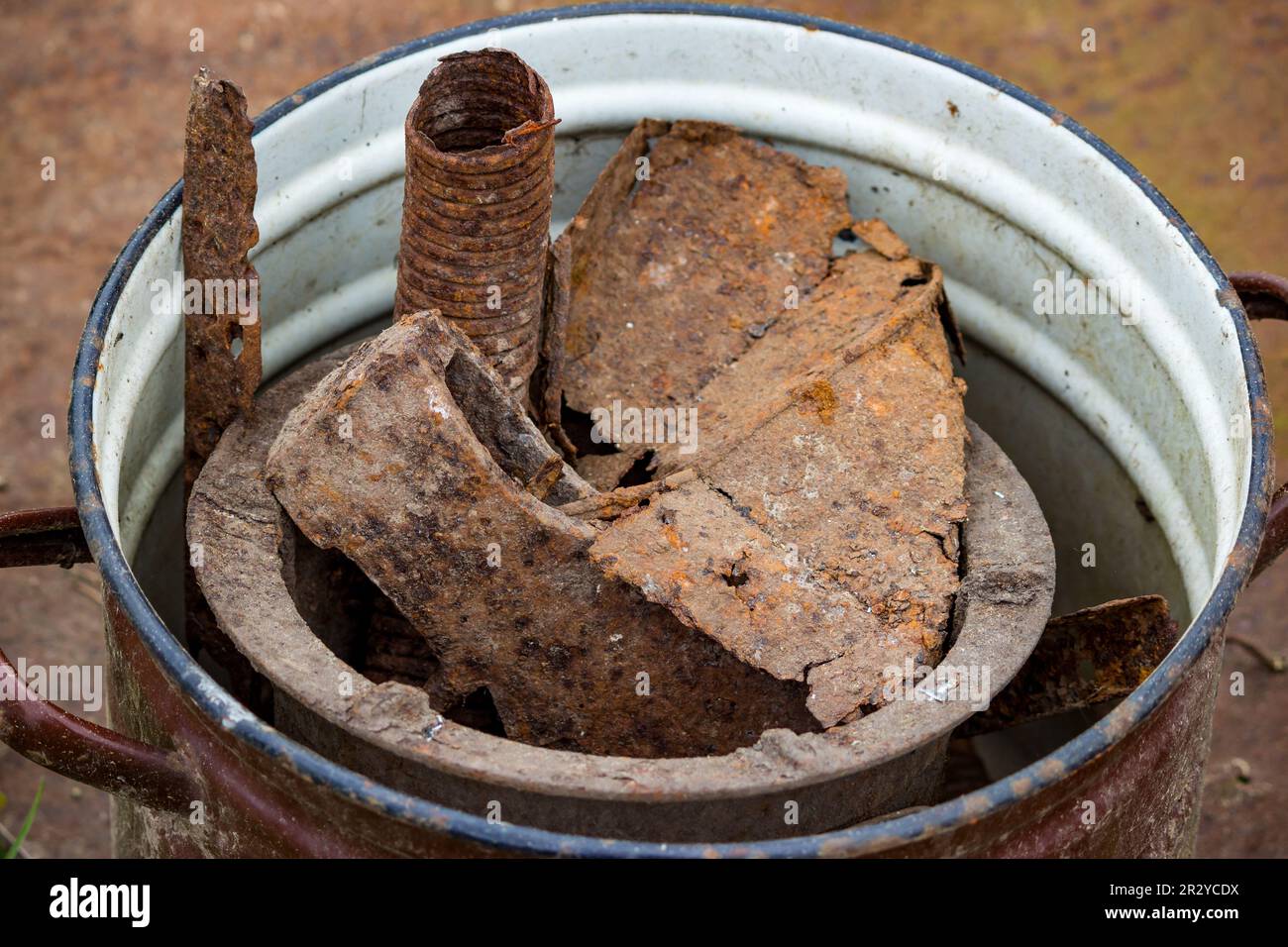 Collected old rusty pieces of iron in a bucket Stock Photo Alamy