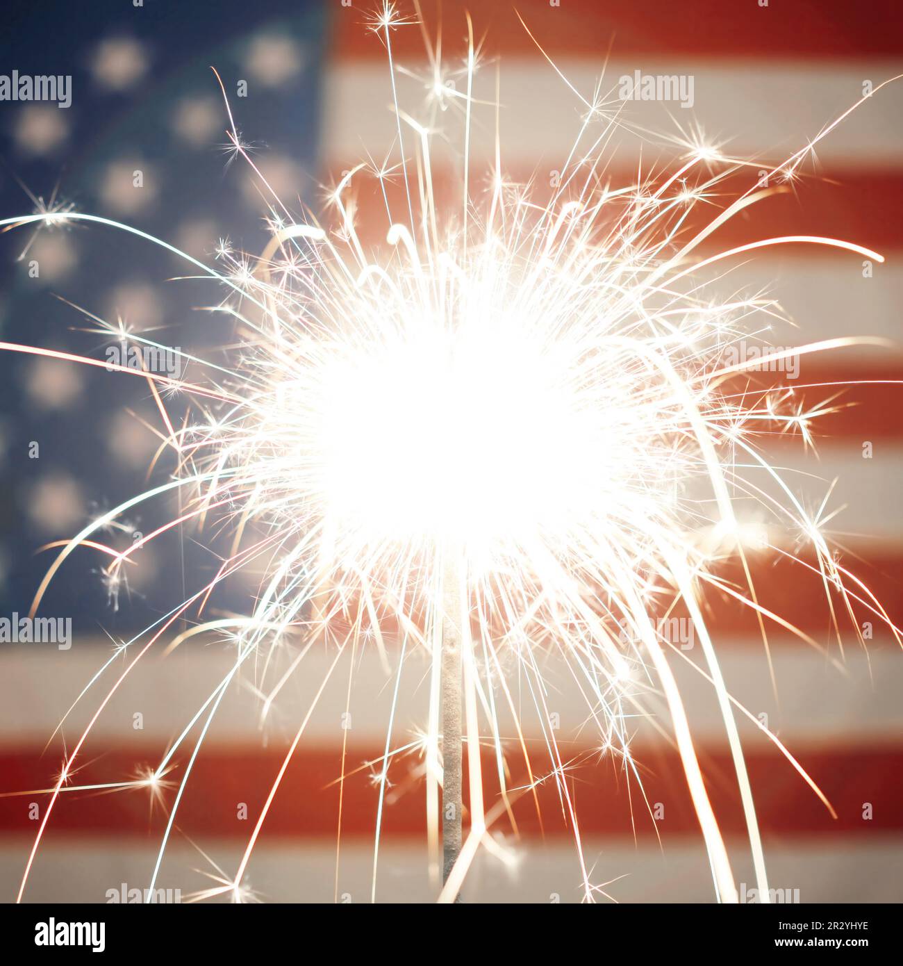 Lit sparkler burning in front of American Flag Stock Photo - Alamy