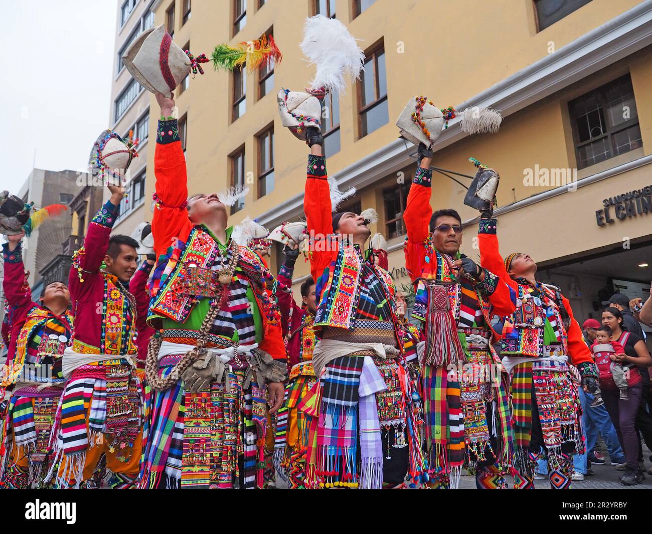 Lima, Peru. 21st May, 2023. Group of men performing when Peruvian Indigenous folk dancers wearing traditional costumes from the Andean regions took to the streets of Lima downtown again, as they used to do every Sunday before the pandemic, to spread their colorful dances and ancestral traditions. Credit: Fotoholica Press Agency/Alamy Live News Stock Photo