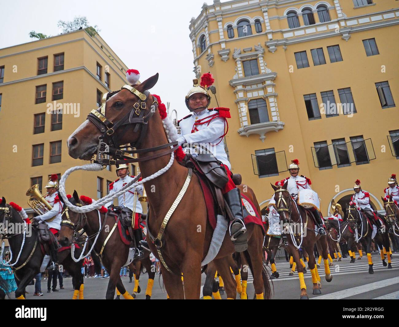 Lima, Peru. 21st May, 2023. Cavalry regiment of the presidential escort passing through the main square when Peruvian Indigenous folk dancers wearing traditional costumes from the Andean regions took to the streets of Lima downtown again, as they used to do every Sunday before the pandemic, to spread their colorful dances and ancestral traditions. Credit: Fotoholica Press Agency/Alamy Live News Stock Photo